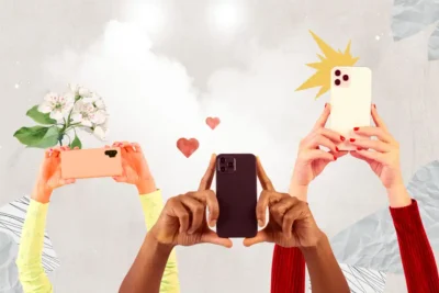 Imagem de várias pessoas segurando smartphones para tirar fotos ou vídeos, destacando o tema da queda de confiança em influenciadores na era digital.